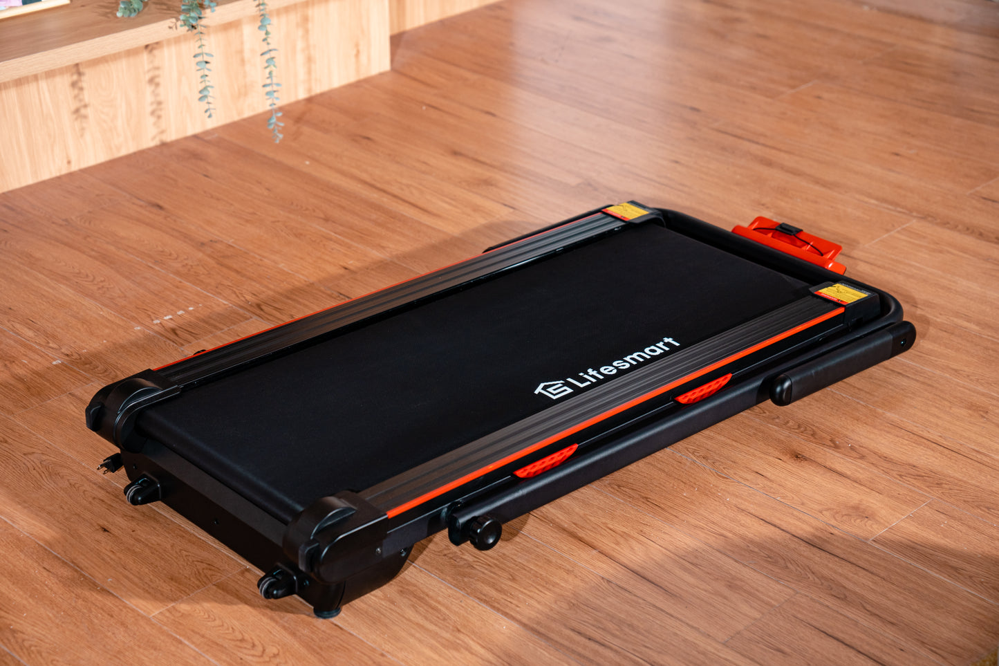 Lifesmart TM2305 2-in-1 Treadmill folded into under desk treadmill mode for walking while working.