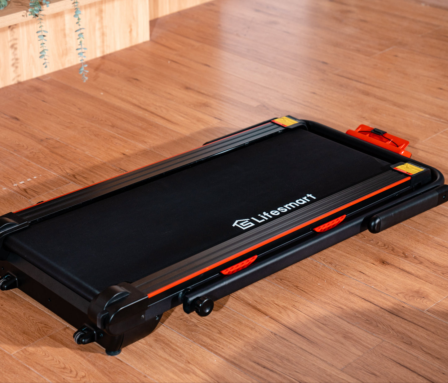 Lifesmart TM2305 2-in-1 Treadmill folded into under desk treadmill mode for walking while working.