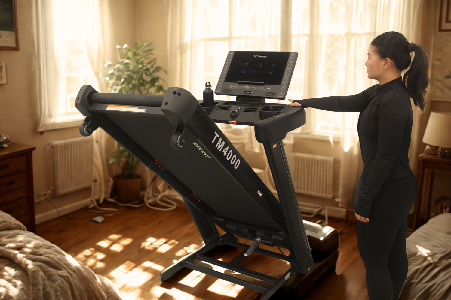 Woman using a treadmill in a home setting with sunlight streaming through the windows. Powertouch technology only on LifeSmart treadmill