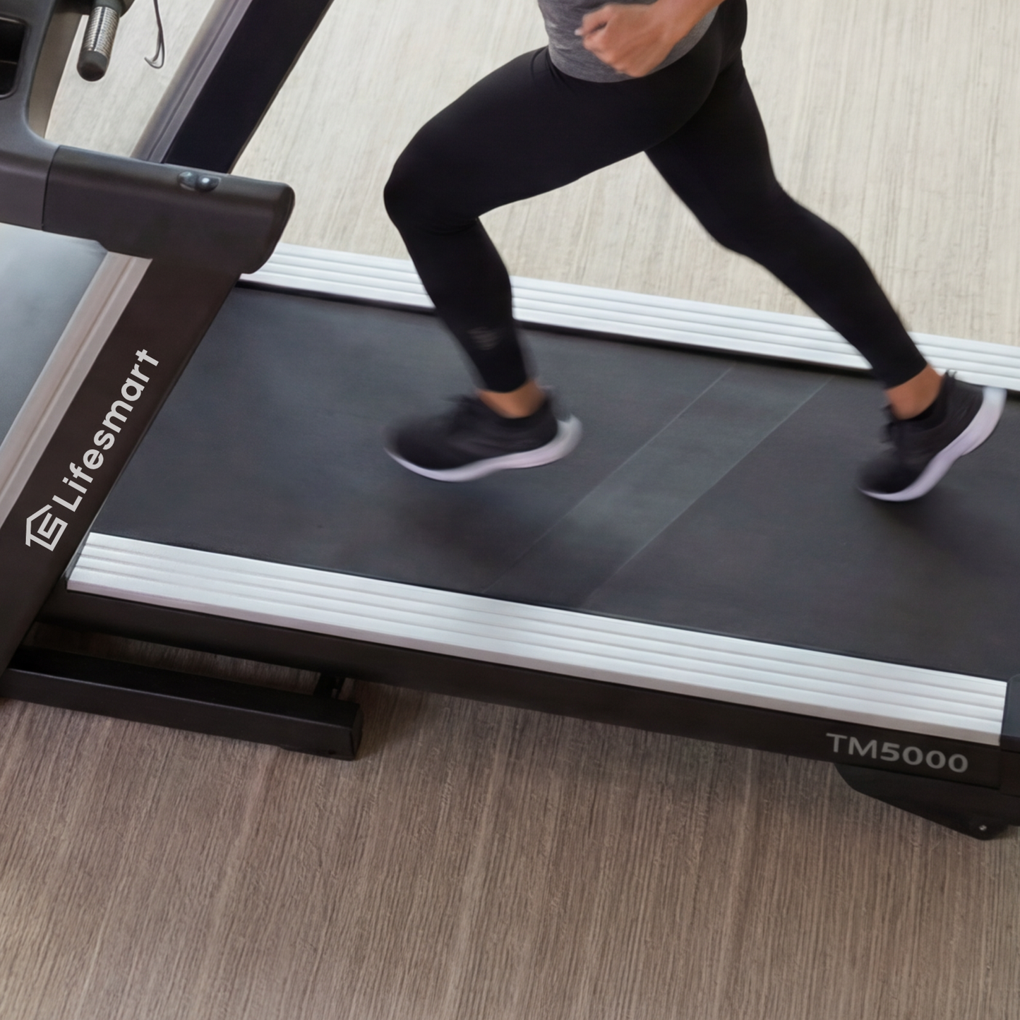 Woman exercising on a TM5000 LifeSmart treadmill in a modern home setting
